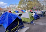 Tents line both sides of SW 13th Avenue in Portland, shown in this April 4, 2022 file photo. Many campers have stayed in this area because of the close proximity Outside In where they are able to access support services.