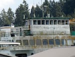 The retired state ferry Hyak is accumulating moss and grime while it sits on the market awaiting a new owner. The boat is shown moored in Eagle Harbor in late October 2025.