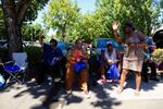 Residents wave as the Good in the Hood parade marched down Martin Luther King Jr. Blvd in Northeast Portland.