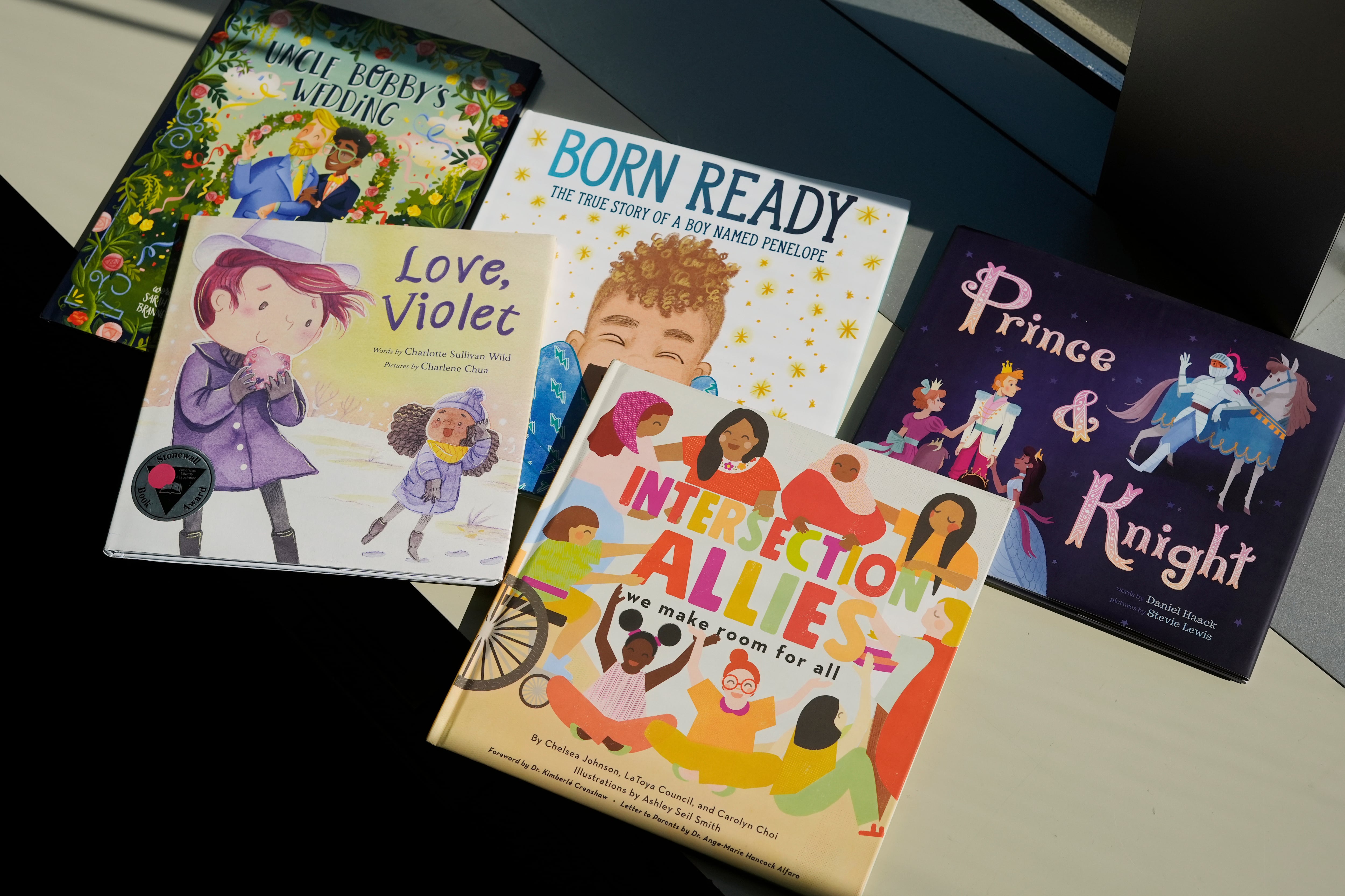 FILE - A selection of books featuring LGBTQ characters that are part of a Supreme Court case are pictured, April, 15, 2025, in Washington.