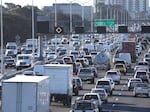 Traffic moves along Interstate 80 in Berkeley, Calif., on Feb. 16, 2022. The Biden administration proposed new tough emission rules so tough it would force auto makers to boost sales of electric cars to meet the requirements.