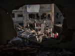 Palestinians look at the destruction after Israeli strikes on the Gaza Strip in Khan Younis, Nov. 4, 2023.