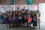 A group photograph of Mo Pandiarajan with his students in the classroom of Eden School, Muthupetty, rural Tamil Nadu. The school was built after remodelling his parents' home where he teaches students upto class 5.