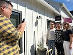 Ed Kim playing paparazzi for his mom Jane with fans of "The Korean Mama" on April 2, 2024. Their social media account follows Jane while she gives food reviews and has more than a million followers.