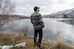 John Sirois of the Colville Tribes looks over an area where salmon swam before the Chief Joseph Dam was built. Fish have been released here ceremonially, but the dam blocks them from reaching the ocean, where salmon finish maturing, so the fish released here cannot rebuild the river’s population.
