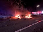 A car on fire after a two-vehicle crash caused by street racing in North Portland on Saturday Feb. 18, 2023. One of the drivers in the crash later died of their injuries. 