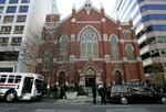A hearse carrying the casket of Rosa Parks and a 1950s era bus sit in front of the Metropolitan AME Church where a memorial service for the civil rights icon was being held on Oct. 31, 2005, in Washington, D.C. A judge has ordered the naming rights of the extremist group the Proud Boys be given to the church.