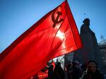 Russian Communist supporters hold flags including one of the Soviet Union, as they take part in a rally next to the Karl Marx monument, marking the "Defender of the Fatherland Day," the former "Day of the Soviet Army", in downtown Moscow on Feb. 23.