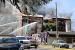 Firefighters battling the fire at the May Apartments in downtown Portland. 