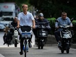 Motorists drive during the morning rush hour in Beijing on Friday.