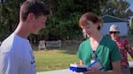 Erin Gossett hands her son Fox a special gift to commemorate his first solo flight in a glider. It is a watch owned by her late husband, Fox's dad. "He would have been amazed at what you've accomplished," she said. 