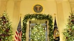 Christmas trees line the Grand Foyer during a tour of the Christmas decorations inside the White House in Washington, D.C., on Monday.