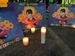 FILE - Signs memorializing Aidan Ellison at the Jackson County Courthouse steps in Medford, Ore., on Dec. 3. 2020.