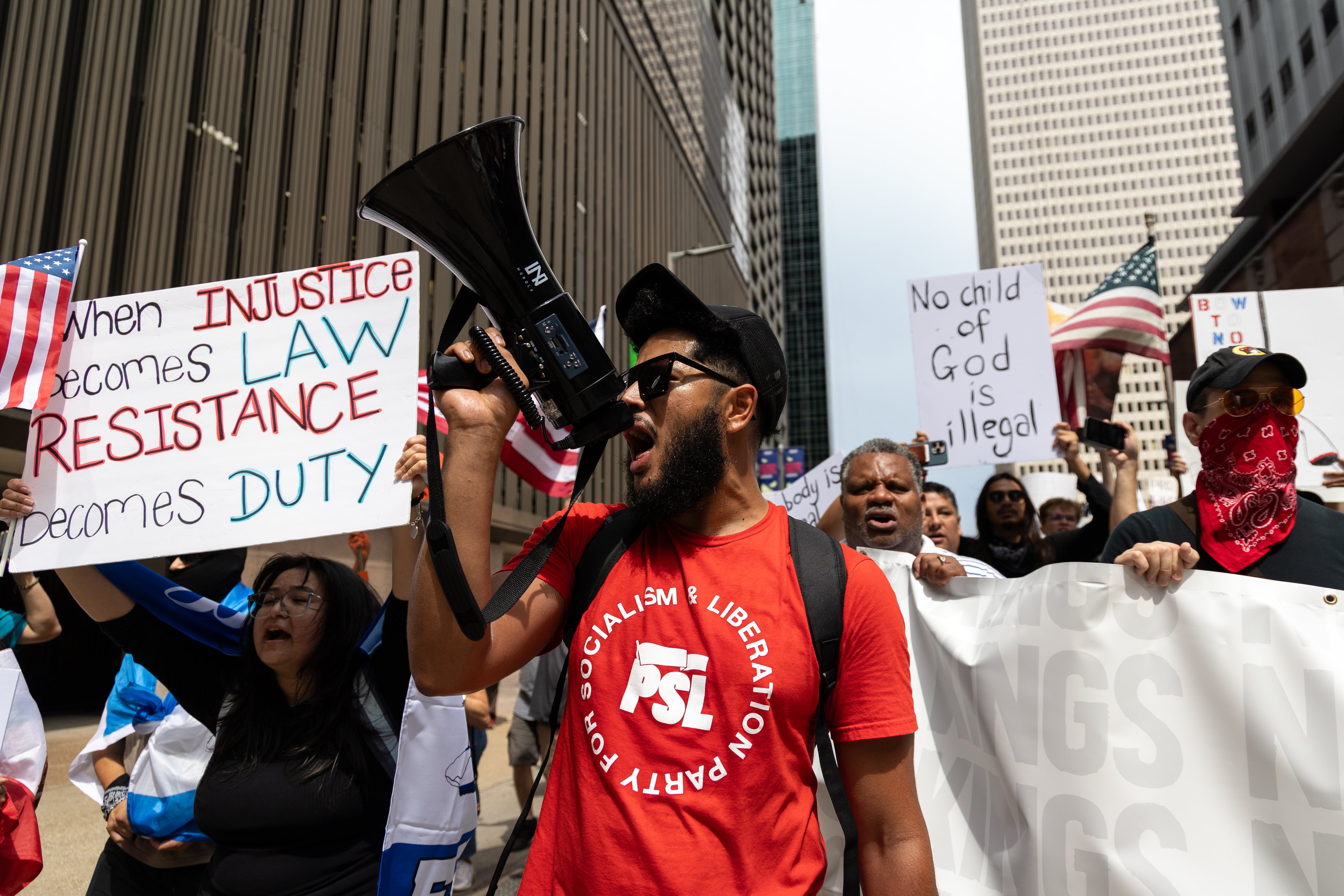 Houston: A protester shouts with a megaphone at No Kings protest.