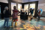 In this provided photo, visitors explore the exhibit "Heads & Hearts: Seeing the Landscape through Nez Perce Eyes" at the Oregon Museum of Science and Industry on Saturday, Jan. 10, 2026.