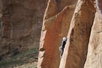A person scales a cliff at Smith Rock State Park in Terrebonne, Oregon. Smith Rock is a popular destination for rock climbers from all over the Northwest.