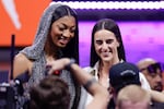 LSU's Angel Reese, left, and Iowa's Caitlin Clark, right, pose for a photo before the WNBA basketball draft, Monday, April 15, 2024, in New York.