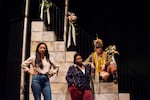 Stephanie Ybarra (left), Bridgette Burton and Rachael Erichsen stand onstage.