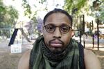 Mac Smiff poses for a photograph in Wilshire Park in Portland, Ore., on Wednesday, July 29, 2020. Smiff, who has been protesting almost every night for weeks, was arrested by the Portland Police Bureau while attending a Black Lives Matter protest. An Associated Press analysis of more than 200 arrests shows that even those accused of breaking the law during the nightly rallies don’t neatly fit into President Donald Trump’s depiction of protesters as “anarchists and agitators.”