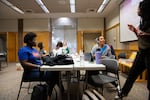 (from left) Danneilla Wilson, Amiyah McGregory and Makena Parel work on homework and chat at an Ujima meeting on Wednesday, Oct. 16, 2024 in Bend, Ore.