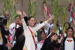 New President Claudia Sheinbaum gestures to the crowd during a ceremony on her inauguration day in the Zocalo, Mexico City's main square, Tuesday, Oct. 1, 2024.