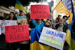 Ukrainians who live in Lebanon holds placards and chant slogans during a protest against Moscow's wide-ranging attack on their country, outside the Russian embassy in Beirut, Lebanon, Thursday, Feb. 24, 2022. World leaders expressed a raw outrage shrouded by an impotence to immediately come to the aid of Ukraine to avoid a major war in Europe, condemning Russia’s attack on its neighbor as the European Union and others promised unprecedented sanctions to hit the Kremlin.