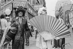 American gay liberation activist Marsha P. Johnson (center left), along with unidentified others, on the corner of Christopher Street and 7th Avenue during the Pride March in New York City on June 27, 1982.