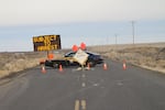 Police stand guard at the access road to the Malheur National Wildlife Refuge, Feb. 5.