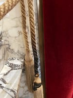 A vandal burned a braided tieback to a drape inside the state reception room of the Washington state Capitol on Oct. 5, 2025.