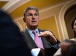 Sen. Joe Manchin speaks with reporters at the U.S. Capitol in Washington, D.C., on March 22, 2023. Manchin was a critical vote in passing President Biden's massive climate bill, but he's expressed frustration with the implementation of electric vehicle components.