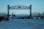 Kayaktavists blocked the Fennica, Shell's icebreaker ship, from leaving the port of Portland Wednesday, July 29, 2015. The railroad bridge was raised, but no boats ever crossed through. The Fennica can be seen in the background to the left of the cranes.