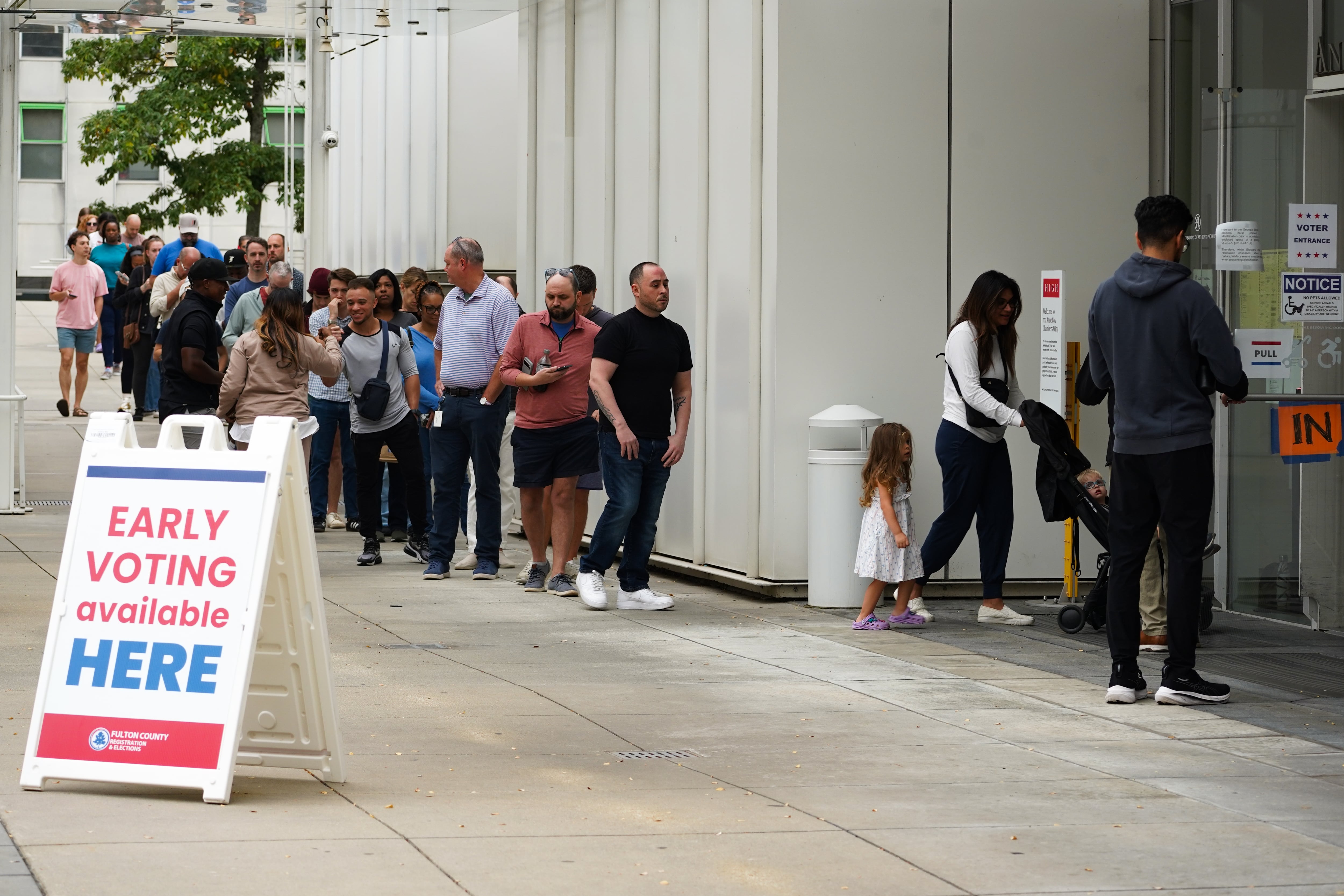 In this file photo, voters head into a polling location to cast their ballots on the last day of early voting for the 2024 election on November 1, 2024 in Atlanta, Georgia. A new federal report shows early in-person voting increased from 2020 to 2024.
