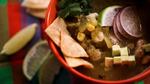 Fragrant, spicy Green Chicken Posole with tomatillos is Mexican-inspired but hominy and caramelized onions suggest a hint of the American South. Ramona White's thoughtful recipe includes quick-and-easy options and a vegan variation.
