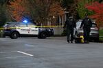 Portland police officers investigate a shooting on Oct. 26, 2021 in North Portland. 