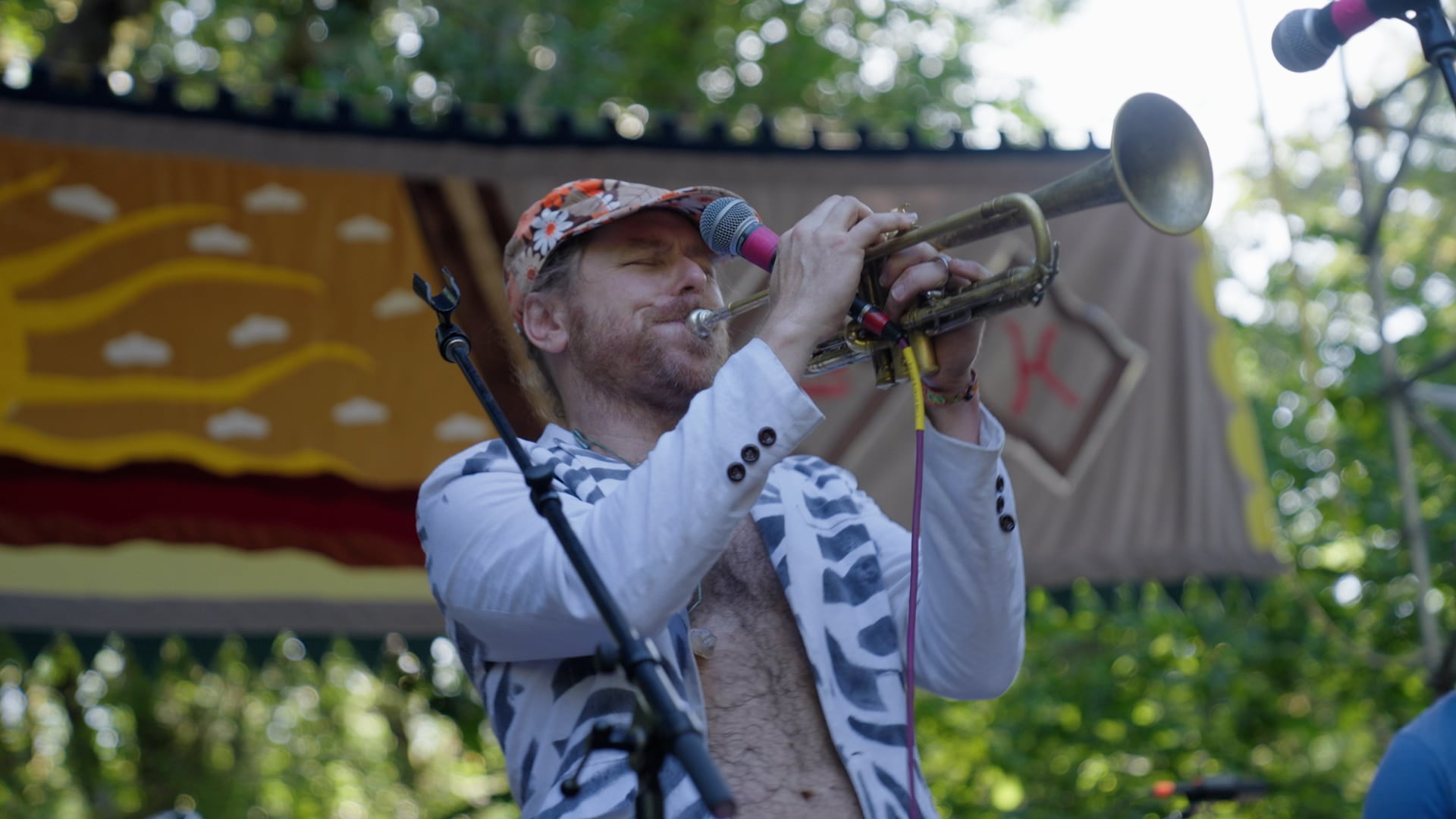 Lead singer/trumpet player Lech Wierzynski and the band The California Honeydrops entertain fairgoers on the Oregon Country Fair main stage on July 14, 2024.