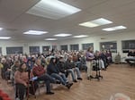 Roughly 100 people attended the Waldport City Council meeting on Dec. 10, 2025, to express their opposition to any type of ICE facility in the city. The crowd spilled out into an adjacent hallway.