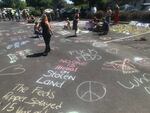 The scene at a Bend parking lot the day after protesters delayed ICE arrests by creating a human roadblock, Aug. 13, 2020.