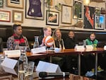 FILE: U.S. Sen. Ron Wyden and Portland Thorns GM Karina LeBlanc, left, tell WNBA commissioner Cathy Engelbert about Portland's passion for women's sports. Feb. 2, 2023