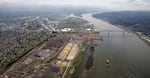 FILE: Timber-processing facilities, including Weyerheauser's, line the banks of the Columbia River near the Port of Longview in Longview, Wash.