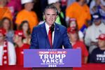 North Dakota Gov. Doug Burgum, pictured at a campaign rally early this month in Michigan, would play a key role in pushing President-leect Donald Trump's agenda to increase oil, gas and coal production on public lands if he is confirmed as secretary of the Interior Department.