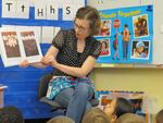 Kindergarten teacher Alia Woolfe reads to her students.