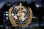 A picture taken on March 9, 2020 shows the sign of the World Health Organization (WHO) at the WHO headquarters in Geneva. - The World Health Organization said on March 9, 2020 that more than 70 percent of those infected with the new coronavirus in China have recovered, adding that the country was "bringing its epidemic under control". 