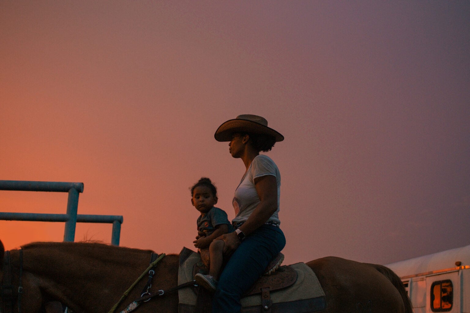 Tiffanie and Liam Carter featured on a horse.