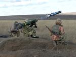 In this image taken from footage provided by the Ukrainian Defense Ministry Press Service, Ukrainian soldiers use a launcher with U.S. Javelin missiles during military exercises in the eastern Donetsk region of Ukraine, on Jan. 12. The U.S. and NATO allies have been ramping up military aid to help Ukraine fend off Russian forces.