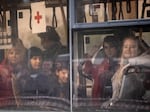 Evacuees arrive by bus at an evacuation point for people fleeing the Azovstal plant, Mariupol, Melitopol and surrounding towns under Russian control, on May 3 in Zaporizhzhia, Ukraine. Scores arrived from Mariupol, including the first group who escaped the Azovstal steel facility, following negotiations brokered by the United Nations and the International Committee of the Red Cross.