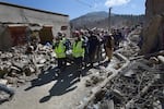 Rescue teams and civil protection members search the rubble for bodies of victims that perished in the devastating earthquake in Imi N'Tala, Morocco, on Sept. 13.