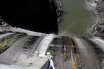 FILE - Excess water spills over the top of a dam on the Lower Klamath River known as Copco 1 near Hornbrook, Calif.