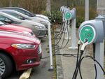 In this undated file photo, electric car batteries are charging at a charging station.