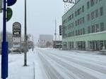 Snow falls at West Burnside and Northwest 21st Avenue in Portland around 10:30 a.m. on Saturday.
