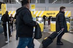 Passengers check in for their Spirit Airlines flights at O'Hare Airport on March 10, 2026 in Chicago, Illinois. The budget airline has announced it will cease operations.